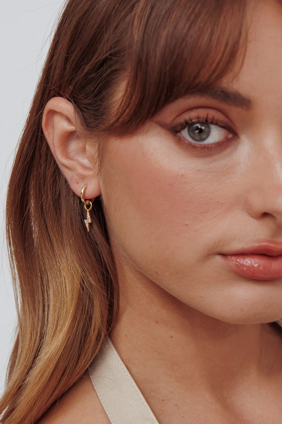 Celeste Lightning Zircon Earrings Gold